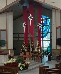 the interior of a church decorated for christmas