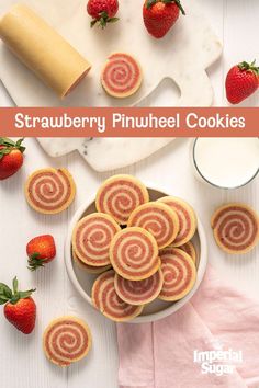 strawberry pinwheel cookies on a plate with strawberries