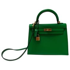 Hermes Bamboo Kelly 25 Bag. Excellent like new condition. Interior clean. Plastic is still on the hardware. Most wanted size Kelly. Rare small size. Includes clochette, lock, keys, and dust bag. Guaranteed authentic. Luxury Green Bag With Lock, Luxury Green Bags With Lock, Green Satchel With Palladium Hardware, Green Satchel With Palladium Hardware And Top Handle, Classic Green Satchel With Branded Hardware, Life Magazine Covers, Kelly 25, Chanel Flap Bag, Interior Clean