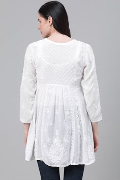 White Chikankari Short Top Kurti Handcrafted is perfect for any occasion. It is made of soft muslin silk material and features all over beautiful handcrafted fine chikankari floral embroidery. Pair it with our chikankari sharara/gagara palazzo pants and mulmul dupatta for effortless chic look. Length 31" inches Long sleeves 16" inches Round neck A line Embroidered Muslin Silk Chikankari embroidery Handwork Margin: no Dry Clean Disclaimer: Since the product is hand embroidered, Motifs may vary sl Chikankari Sharara, Phulkari Pants, Lucknowi Kurta, Patiala Salwar Suits, Chikankari Embroidery, Bridal Dupatta, Phulkari Dupatta, Chikankari Suits, Velvet Shawl