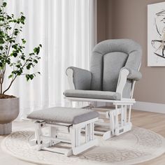 a living room with a chair, ottoman and potted plant on the floor in front of a window