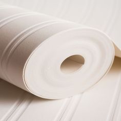 a roll of white paper on top of a table