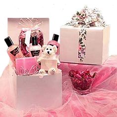 two white boxes filled with pink and white items