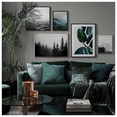 a living room with green furniture and pictures on the wall above it, along with a coffee table