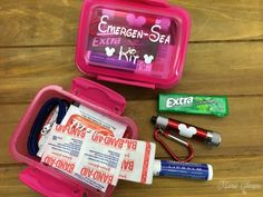 the contents of an emergency kit laid out on a wooden table, including toothbrushes and other items