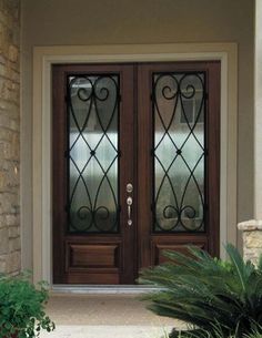 the front door to a house with two glass doors