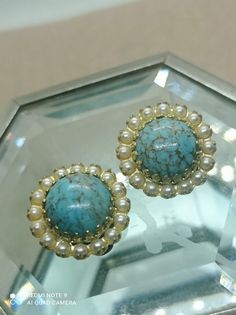 Old clip earrings circa 1950, round clips with large Beijing glass cabochons decorated with seed beads, women's gift Vintage 50s measurements: 2x2 cm materials: gold metal, Beijing glass, seed beads In good vintage condition Vintage clip-on earrings with Beijing glass. turquoise color. Dome-shaped cabochon. with seed beads The clips are very tender Good gift for wife Vintage Round Clip-on Jewelry, Round Vintage Clip-on Jewelry, Vintage Turquoise Earrings With Round Beads, Round Clip-on Costume Jewelry, Vintage Turquoise Round Earrings, Elegant Round Earrings With Bead Caps, Vintage Turquoise Earrings For Party, Vintage Round Clip-on Earrings With Cabochon, Vintage Beaded Round Earrings