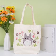 Japanese Totoro Canvas Tote Bag,Shopping Tote Bag,Handmade Bag,Eco Bag,Birthday Gift,Gift for Her,Back to School, Christmas Gift Cute and stylish simple tote bag for casual use and perfect look! Three colors available:pink blue off-white There is a small pocket inside the bag, which can be used to store keys, lipstick, etc., perfect for storing your small items. Size:13.38''x5.11''x13.38'' This totoro will definitely make your day Minimalist style and eco-friendly durable materials If you have a Totoro Tote Bag, Totoro Embroidery, Desain Tote Bag, Corduroy Tote Bag, Winter Bags, Simple Tote, Christmas Tote Bags, Kiki's Delivery Service