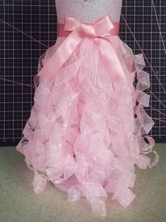 a dress made out of tulle and bows