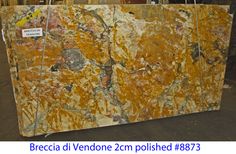 a large marble slab is being displayed in a shop with the words breccia di vendie 2cm polished