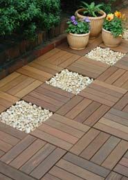 some potted plants sitting on top of a wooden floor