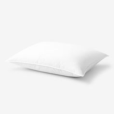 a white pillow on a gray background