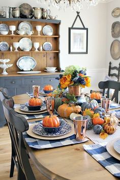 a dining room table set for thanksgiving dinner