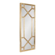 a mirror that is sitting on top of a white wall and it has gold trim around the edges