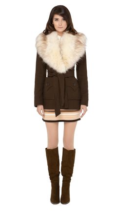 Immediately striking seventies winter jacket with indistinguishable from the real thing cruelty free cream oversized faux fur collar, top stitched deep essentials front pockets and belt closure.   Cozy, comfy and cool.  Pairs well with our 1970s Style Jersey Dress to complete the look.  Unsure of your size? Use our chat feature. Fitted Winter Outerwear With Belted Cuffs, Chic Winter Outerwear With Belted Cuffs, Belted Long Sleeve Fur Coat For Fall, Brown Belted Winter Outerwear, Winter Faux Fur Belted Outerwear, Belted Brown Outerwear For Winter, Fall Faux Fur Belted Outerwear, Winter Collared Outerwear With Belted Cuffs, Winter Belted Faux Fur Coat