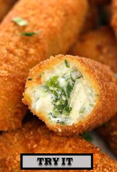 some fried food is on a plate with toothpicks and parmesan cheese