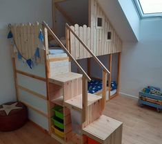 there is a bunk bed with stairs to the top and bottom floor in this children's room