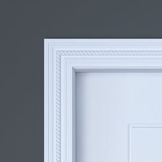 an open white door on a gray wall