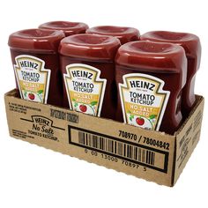 six bottles of heinz tomato ketchup in a cardboard box