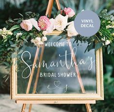 a sign with flowers on it that says, welcome to savannah's bridal shower