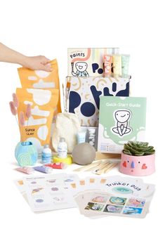 the contents of a baby's diaper bag are displayed on a white background