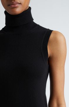 This luxe turtleneck knit from supersoft cashmere in a sleeveless silhouette is the wear-with-everything sweater you'll reach for again and again. Turtleneck Sleeveless 100% cashmere Dry clean Imported Designer Clothing Fitted Turtleneck Sweater Vest For Fall, Elegant High Neck Sweater Vest For Fall, Fitted Fine Knit Sweater Vest For Fall, Fitted High Neck Sweater Vest For Layering, Fitted Cashmere Turtleneck In Chic Style, Fitted High Neck Sweater Vest For Fall, Elegant Fitted Fine Knit Sweater Vest, Fitted Fine Knit Sweater Vest For Winter, Black High Neck Sweater Vest For Fall