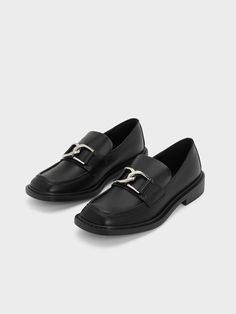 Introducing the newest member of the Gabine family: a pair of elegant leather loafers. These loafers showcase the iconic U-shaped buckles interlocked across the front in a sleek silver tone, adding a touch of understated glamour to the classic design. With their easy-to-wear and style nature, these loafers are a valuable addition to your collection. Pair them with pants for a cool androgynous look or wear them with a skirt for an edgy twist. Androgynous Look, Brand Collaboration, Size Chart For Kids, Charles Keith, Belt Size, Leather Loafers, Leather Heels, Comfortable Shoes, Calf Leather