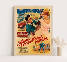 an old movie poster on the wall next to a vase