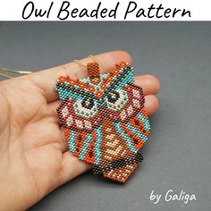 an owl beaded pattern is being held by a person's hand with the words owl beaded pattern on it