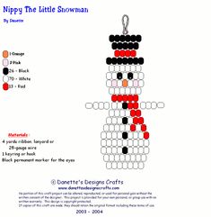 a cross stitch snowman ornament is shown in red, white and black