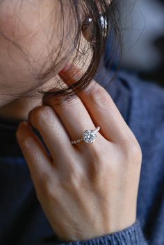 a close up of a person wearing a ring