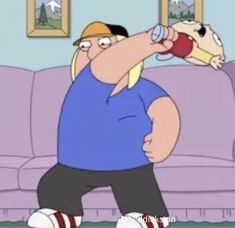 a cartoon character holding a bottle in his right hand while standing next to a couch