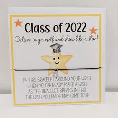 a graduation card with a yellow star on it and the words class of 2012 written in cursive writing