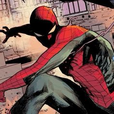 the spider - man is sitting down with his arms outstretched