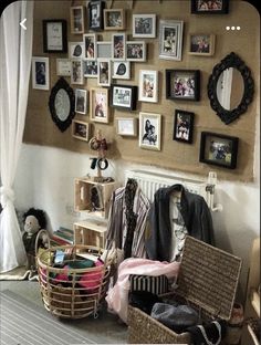 a room filled with lots of pictures on the wall next to a radiator