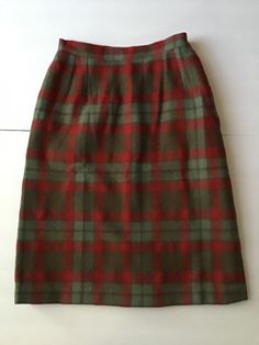 "Vintage 1960's Wool Red/Gray plaid skirt. The label is *A Ronbary Classic*. Has a half lining on the inside in back. Left side metal zipper with a button. There is a pocket on the right side. *SCROLL DOWN FOR MORE INFORMATION* CONDITION: I note on the inside lining in the back there is an 11\" repair (SEE PIX). No other issues noted. Sold As Is! MEASURES: Waist~22\" Hips~34\" Total length~21 1/2\" Under hem~1\" **WE APOLOGIZE~BUT WE CAN NO LONGER SHIP TO GERMANY, ITALY OR SPAIN. WE HAVE INCURRE Gray Plaid Skirt, Grey Plaid Skirt, 1960s Skirt, Vintage Clothing Boutique, Skirt Wool, 80s Outfit, Model Outfits, Little Outfits, Gray Plaid