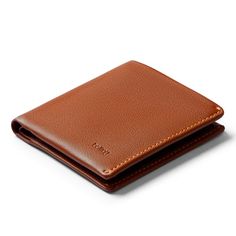 A slim, trim, handsome leather wallet Classic Tan Business Wallets, Tan Bifold Wallet With Card Slots, Leather Wallets For Business, Tan Bifold Wallet For Travel, Classic Tan Travel Wallet, Formal Tan Leather Wallet, Casual Bifold Leather Card Holder, Casual Wallet With Coin Pocket For Business, Modern Tan Leather Wallet