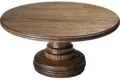 a round wooden table with two pedestals