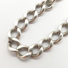 "An antique sterling silver chain bracelet with curb links. This piece was once a pocket watch albert chain and has graduating links, it has since had a modern clasp fitted and been converted to a bracelet. It measures approx. 24 cm or 9.5\", it is 7.3mm wide and weighs approx. 18.23g. Please check out the other items in my shop. Be sure to view all photos and videos for condition and read the titles and descriptions. Sizes are in the latter photos.  Don't hesitate to send me a message with any queries. All my items are used, some are very old, therefore may show signs of wear or use and are all sold as seen. I'll try and point out any defects but please satisfy yourself using the pictures, what you see is what you will receive. I test all precious metals with acids and gemstones with a th Vintage Chain Bracelet With Curb Chain Link, Sterling Silver Curb Chain Bracelet With Oval Links, Silver Curb Chain Link Bracelet, Vintage Silver Chain Bracelet With Oval Links, Vintage Link Bracelet With Silver Chain, Vintage Link Bracelets With Silver Chain, Silver Curb Chain Bracelet, Silver Oval Link Curb Chain Bracelet, Silver Curb Chain Bracelet With Oval Link