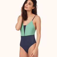 Lively The V One Piece Swimsuit Gear Up For Your Great Escape And In Stand-Out Colorblock That You'll Be Wearing Pretty. Much. Everywhere. Medium: 8-10 Features Deep V Front With Mesh Trim Detail Modern Low Cut Scoop Back To Show Off A Little More Skin High Cut Leg With Back Coverage That’s Not Too Big, Not Too Small Easy Pull-On Style For Ultimate Functionality Sizing/Materials Size Medium Fabric: Outer: 80% Nylon, 20% Spandex Lining: 85% Nylon, 15% Spandex Lo Fun One Piece Swimsuit, Navy Swimsuit, Colorblock Swimsuit, Navy One Piece, Great Escape, Mint And Navy, Swimwear Trends, Striped Swimsuit, Beach Baby