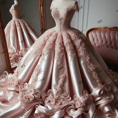 a pink ball gown is shown in front of a mirror with the dress on display