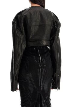 Find RICK OWENS Micro Biker Nappa Jacket on Editorialist. The Rick Owens Micro Biker Jacket is made of vegetable-tanned leather and features a cropped, oversized fit. It has a collarless neckline with a wide pointed lapel, an off-center zip closure, a front pocket with flap, zippered cuffs, and epaulettes on the shoulders. The design is completed by a waist belt with a solid brass buckle plated in palladium. Fully lined. The model is 177 cm tall and wears size IT 40. Leather Cropped Biker Jacket For Fall, Fall Cropped Leather Biker Jacket, Cropped Leather Biker Jacket For Fall, Oversized Leather Biker Outerwear, Edgy Leather Cropped Jacket, Edgy Leather Cropped Jacket With Long Sleeves, Spring Leather Biker Cropped Jacket, Oversized Leather Biker Jacket For Spring, Edgy Cropped Leather Outerwear