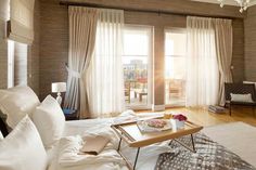 a living area with a couch, coffee table and sliding glass doors that open onto a balcony