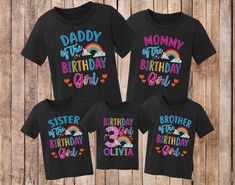 three matching birthday shirts with rainbows and hearts on the front, one in black