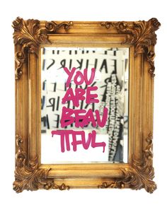 a mirror with the words you are brave written in pink ink on it's gold frame