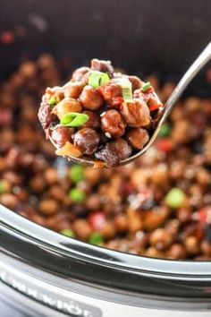 a spoon full of beans and celery in an instant pressure cooker