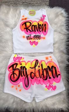 Airbrush Designs by Galveston Airbrush! ♡ ✧ Our Designs on these cute Crop tops and shorts are handmade with the artists' skilled Hands. The ✧Design might look slightly different from the pictures or have small imperfections and that's okay, it's what makes them unique Each design includes up to TWO names or words with up to THREE specified COLORS. Please leave all the design instructions in the personalization section of your order. SIZES: Available for ADULTS DESIGN PLACEMENT: All designs are Air Brush Outfits Ideas, 2000s Airbrush Outfits, Birthday Tops For Women, Baddie Graphic Tees, 90s Spray Paint Outfit, Airbrush Birthday Outfits, Spray Paint Outfit, 90s Colorful Outfits, 90s Hiphop Outfit Women