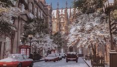 cars parked on the side of a snowy street next to tall buildings and trees covered in snow