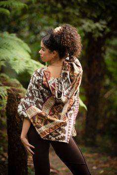 The Primal Poncho is designed to be warm, soft and cosy! Washing instructions: the fabric is breathable so you can hang it up outside to air out instead of washing, or hand-wash with cold water. Our Primal Poncho are hand-made from shawls, which we get in different colours. Please mention in your order comment if you have any colour preferences. Each and every Poncho is unique and one of a kind. Hand made with Love ❀ Bohemian Long Sleeve Cape For Outdoors, Bohemian Long Sleeve Cape For Outdoor, Brown Long Sleeve Poncho For Outdoor, Bohemian One Size Outerwear For Outdoors, Hippie Shawl One Size For Fall, Hippie Shawl For Fall, Hippie Shawl For Fall, One Size, Cozy Shawl Poncho With Scarf, Bohemian Poncho For Outdoor, One Size