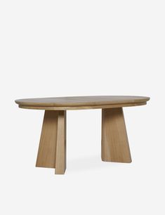 an oval wooden table with two legs